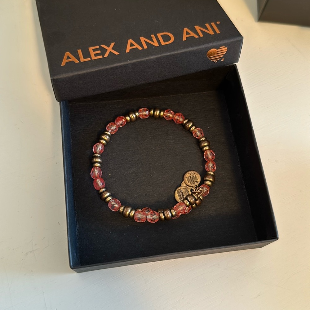 Alex and Ani gold and pink bracelet.